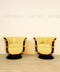 Art Deco tulip armchairs, unique form, highquality leather, macassar wood, highgloss black foot