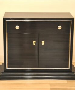 Art Deco Bar cabinet, straight body language, rotating chromebars, clean interior, big swing doors, central drawer, beautiful stair foot