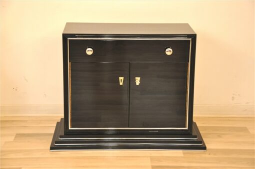 Art Deco Bar cabinet, straight body language, rotating chromebars, clean interior, big swing doors, central drawer, beautiful stair foot