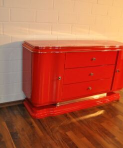 Art Deco Lowboard, red highgloss paintjob, wonderful swing doors, 3 drawers with chromehandles, chromeapplications on the foot