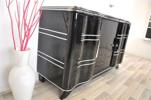 Elegant Art Deco Sideboard, elegant design with curved doors, chromelines and chrome fittings, pianolacquer in highgloss black, handpolished