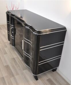 Elegant Art Deco Sideboard, elegant design with curved doors, chromelines and chrome fittings, pianolacquer in highgloss black, handpolished