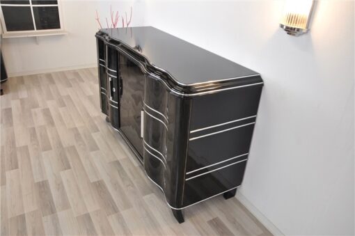 Elegant Art Deco Sideboard, elegant design with curved doors, chromelines and chrome fittings, pianolacquer in highgloss black, handpolished