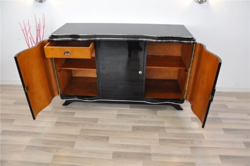 Elegant Art Deco Sideboard, elegant design with curved doors, chromelines and chrome fittings, pianolacquer in highgloss black, handpolished