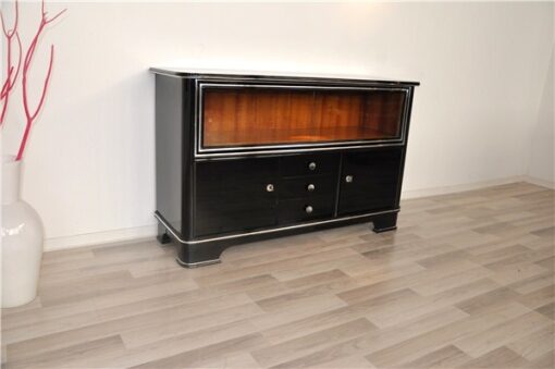 Art Deco Sideboard,black pianolacquer and chrome applications, 2 glas sliding doors infront of a big vitrine compartement, 3 drawers and 2 doors