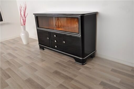 Art Deco Sideboard,black pianolacquer and chrome applications, 2 glas sliding doors infront of a big vitrine compartement, 3 drawers and 2 doors