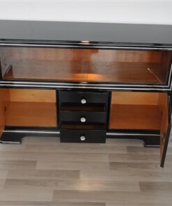 Art Deco Sideboard,black pianolacquer and chrome applications, 2 glas sliding doors infront of a big vitrine compartement, 3 drawers and 2 doors