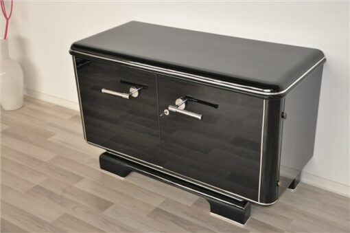 Art Deco Commode, elegant Design with rounded corners, chromelines, big chromehandles, pianolacquer