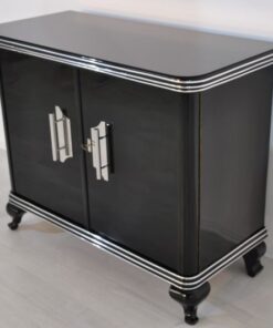 Art Deco Commode, highglossblack pianolacquer,fine chrome details and big chrome handles, clean interior, 1925