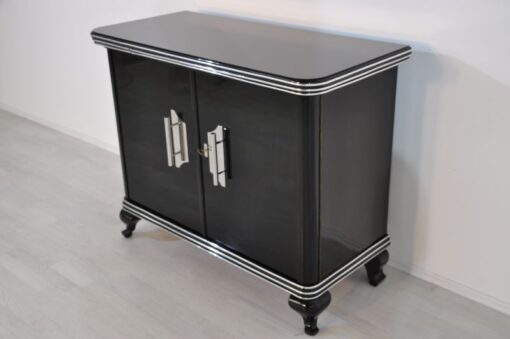 Art Deco Commode, highglossblack pianolacquer,fine chrome details and big chrome handles, clean interior, 1925