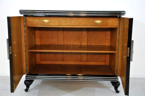 Art Deco Commode, highglossblack pianolacquer,fine chrome details and big chrome handles, clean interior, 1925