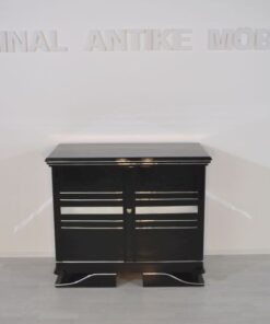 Art Deco Commode, straight forward body language, big chrome applications, wonderful foot, pianolacquer in highglossblack, interior made of cherrywood