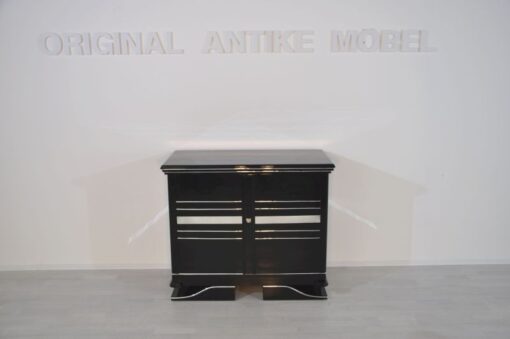 Art Deco Commode, straight forward body language, big chrome applications, wonderful foot, pianolacquer in highglossblack, interior made of cherrywood