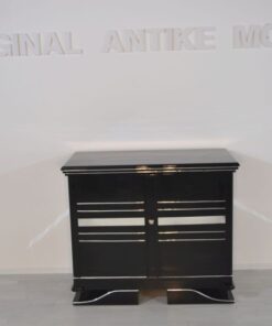 Art Deco Commode, straight forward body language, big chrome applications, wonderful foot, pianolacquer in highglossblack, interior made of cherrywood