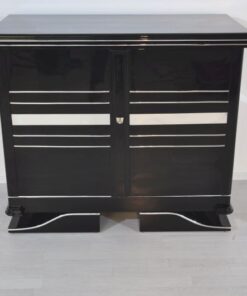 Art Deco Commode, straight forward body language, big chrome applications, wonderful foot, pianolacquer in highglossblack, interior made of cherrywood