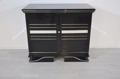 Art Deco Commode, straight forward body language, big chrome applications, wonderful foot, pianolacquer in highglossblack, interior made of cherrywood