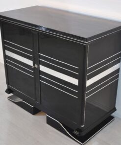 Art Deco Commode, straight forward body language, big chrome applications, wonderful foot, pianolacquer in highglossblack, interior made of cherrywood