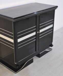 Art Deco Commode, straight forward body language, big chrome applications, wonderful foot, pianolacquer in highglossblack, interior made of cherrywood