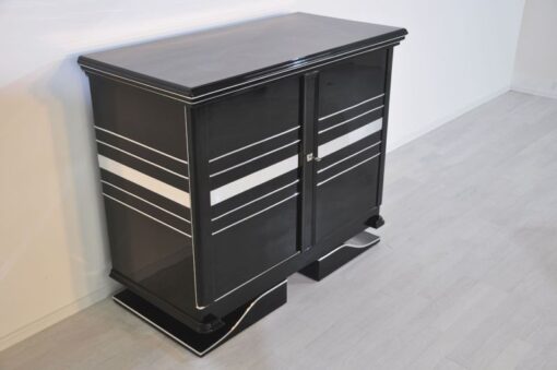 Art Deco Commode, straight forward body language, big chrome applications, wonderful foot, pianolacquer in highglossblack, interior made of cherrywood