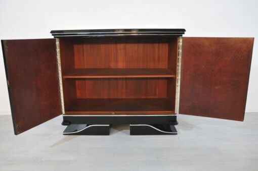 Art Deco Commode, straight forward body language, big chrome applications, wonderful foot, pianolacquer in highglossblack, interior made of cherrywood