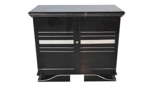 Art Deco Commode, straight forward body language, big chrome applications, wonderful foot, pianolacquer in highglossblack, interior made of cherrywood